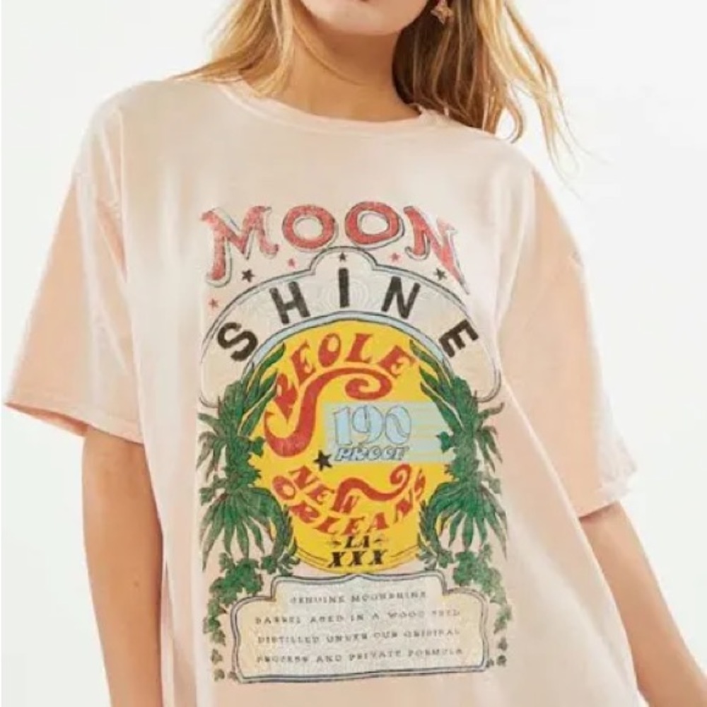 URBAN OUTFITTERS oversized “moonshine” tee. (rip on sleeve)